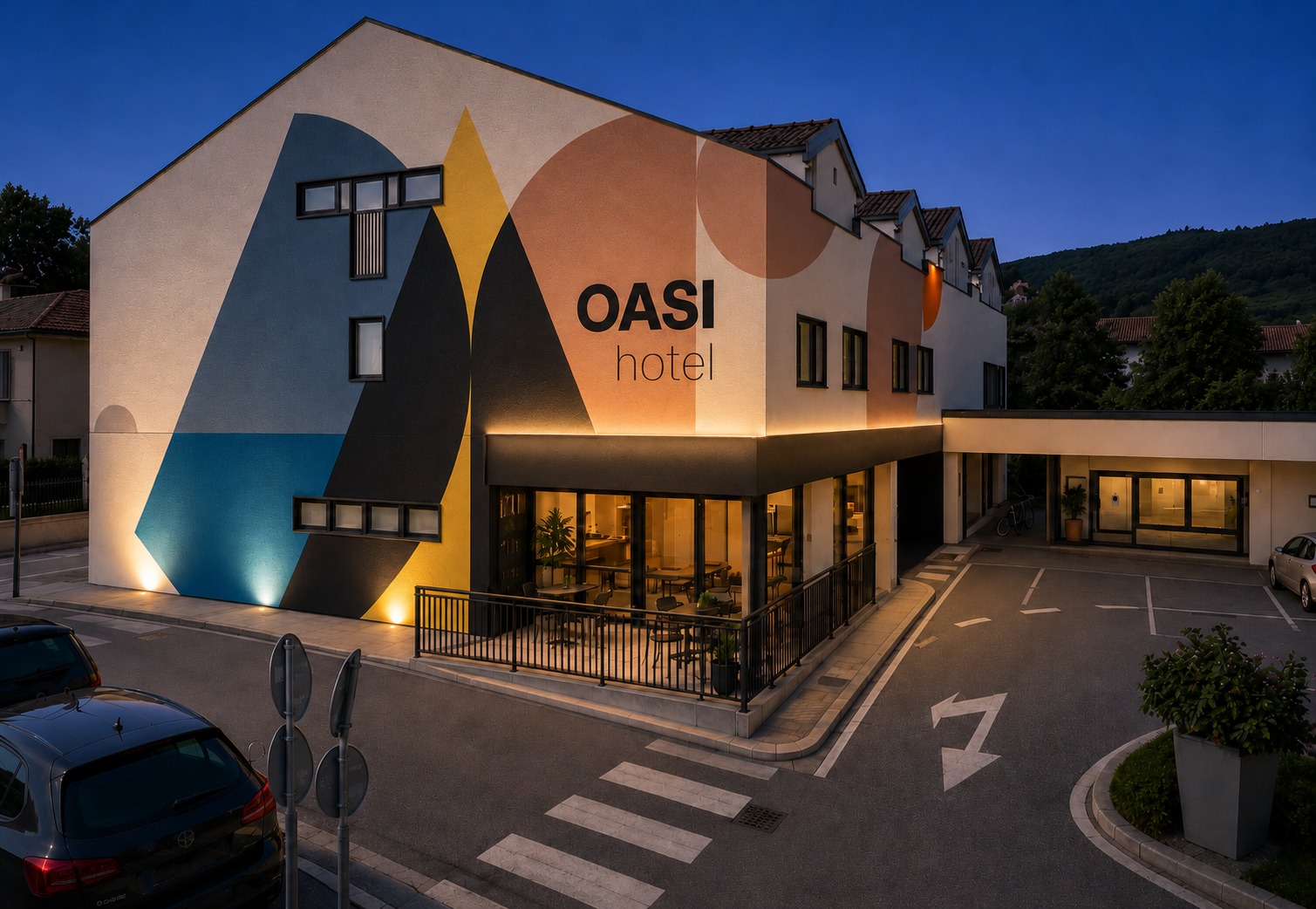 Hotel Oasi exterior at night — renovation concept